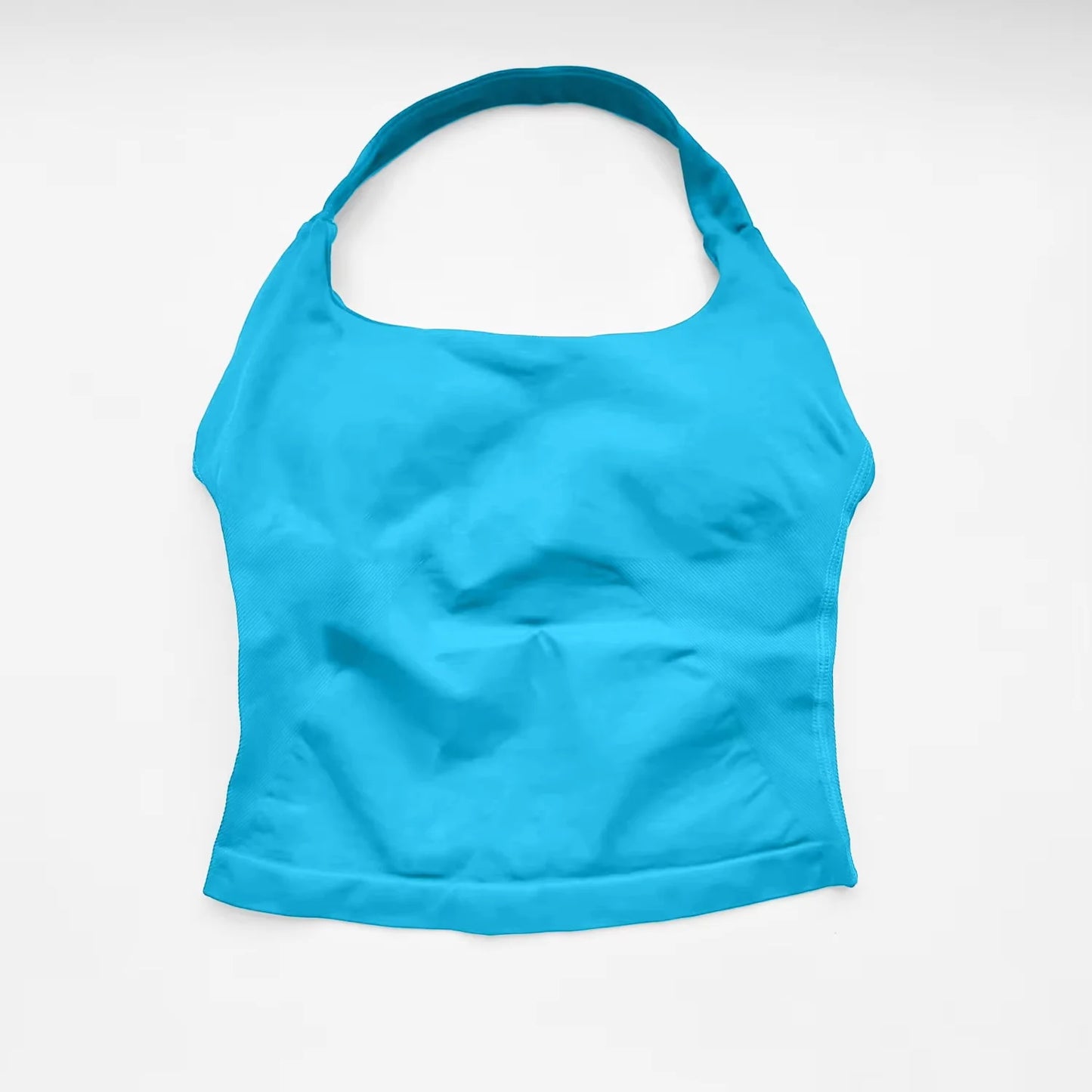 Fierce Ember™ Elevate Halter Training Top in Glacier Blue shown laid flat on a white background, highlighting the halter neckline, fitted silhouette, smooth stretch fabric and clean hem finish.