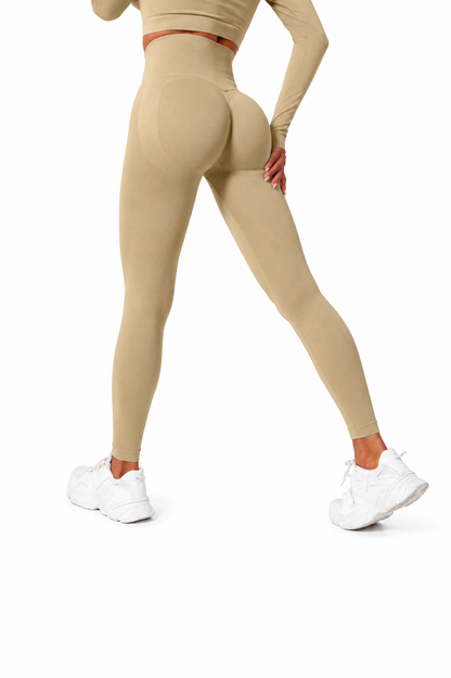 Close-up rear view of Fierce Ember Signature Leggings in sahara, showcasing the seamless sculpting design, high-waisted fit and contour-enhancing performance fabric.