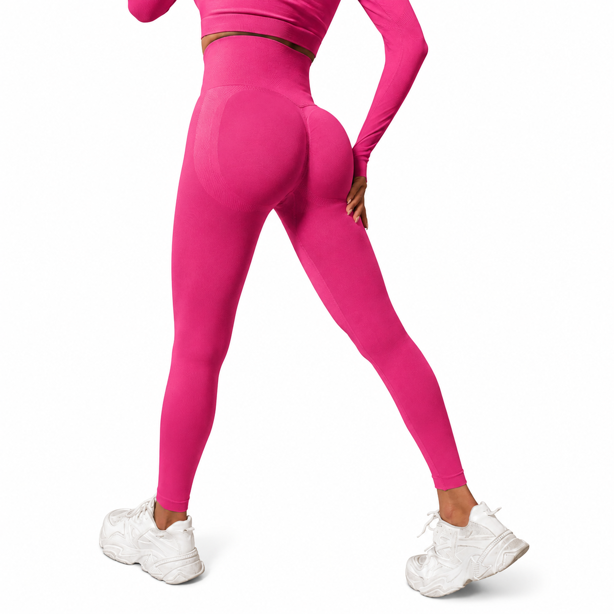 Close-up rear view of Fierce Ember Signature Leggings in vibrant pink, showcasing the seamless sculpting design, high-waisted fit and contour-enhancing performance fabric.