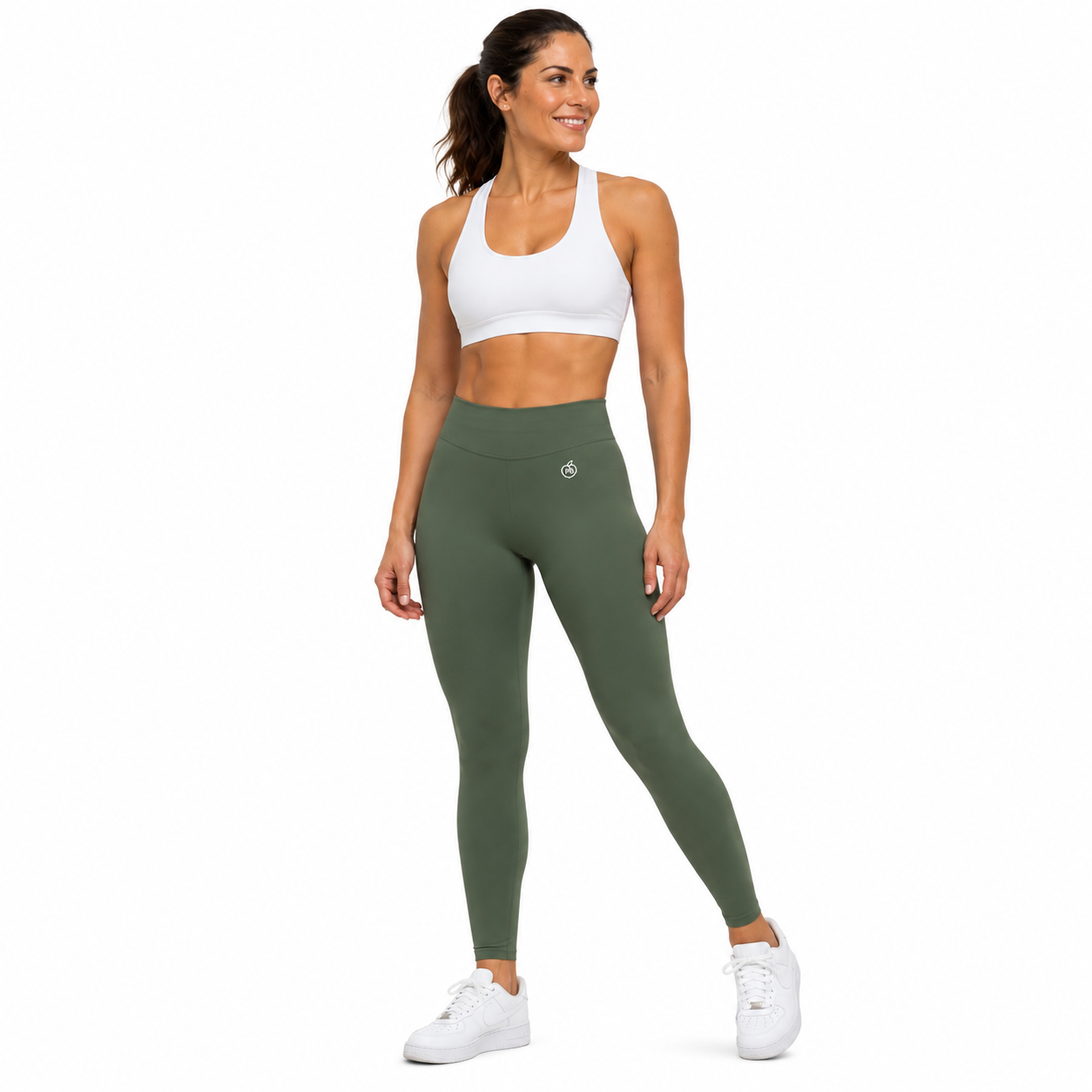 Fierce Ember Ultimate olive green high-rise leggings with seamless front, worn by a woman on a white studio background.