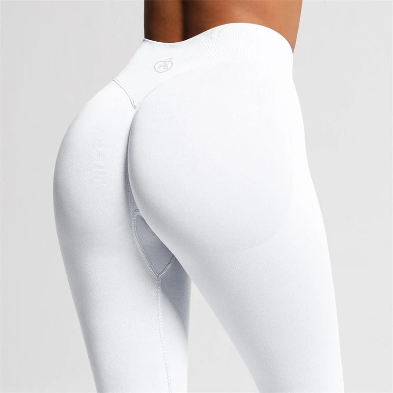 Close-up rear three-quarter view of white Fierce Ember Ultimate Leggings arctic white showing the sculpting waistband and contoured fit.