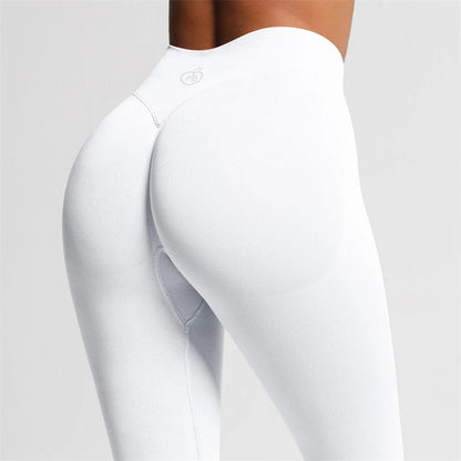 Close-up rear three-quarter view of white Fierce Ember Ultimate Leggings arctic white showing the sculpting waistband and contoured fit.