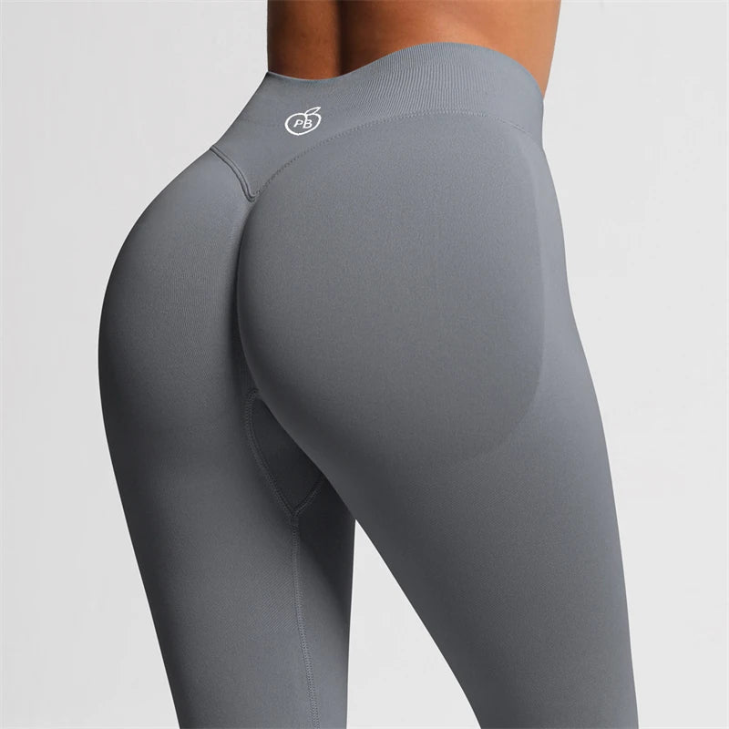 Close-up rear three-quarter view of white Fierce Ember Ultimate Leggings Graphite Grey showing the sculpting waistband and contoured fit.