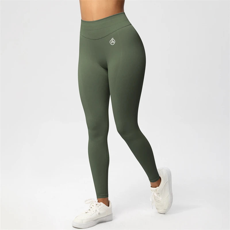 Fierce Ember Ultimate pale olive high-rise seamless leggings with full-length sculpting fit and white hip logo, shown on a white studio background.