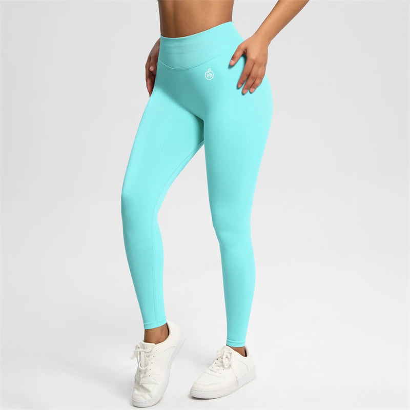 Fierce Ember Ultimate aqua green high-rise seamless leggings with full-length sculpting fit and white hip logo, shown on a white studio background.