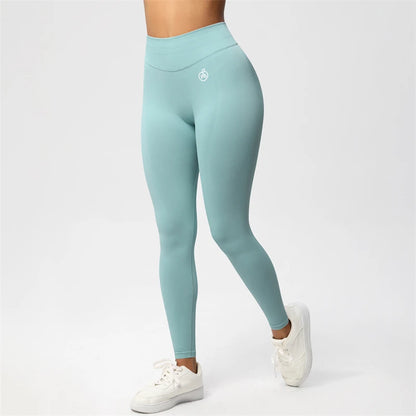 Fierce Ember Ultimate pale blue-green high-rise seamless leggings with full-length sculpting fit and white hip logo, shown on a white studio background.