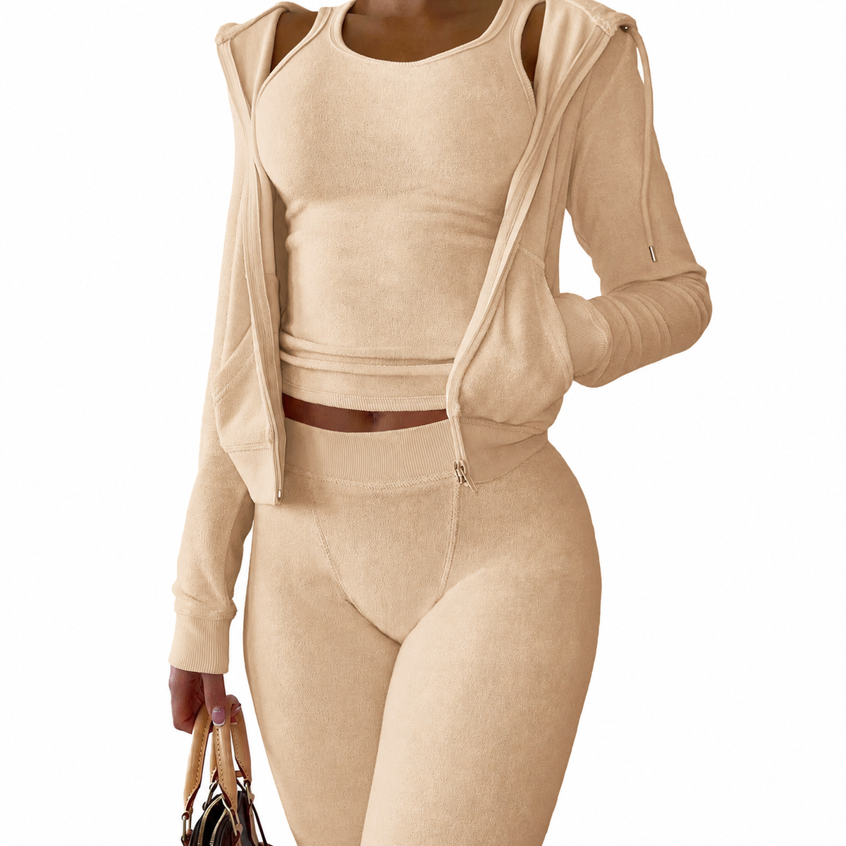 Model wearing Mind Body and Soles Activewear beige 3-piece set with a hooded zip jacket, fitted vest, and leggings.