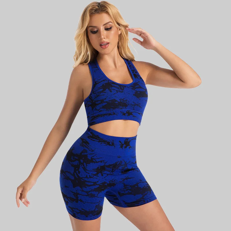 Woman wearing the Mind Body and Soles Power Vibe Energy seamless sports bra and high-waisted shorts set in sapphire blue