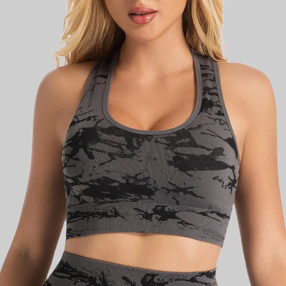 Woman wearing the Mind Body and Soles Power Vibe Energy seamless sports bra and high-waisted shorts set in Dark Grey.