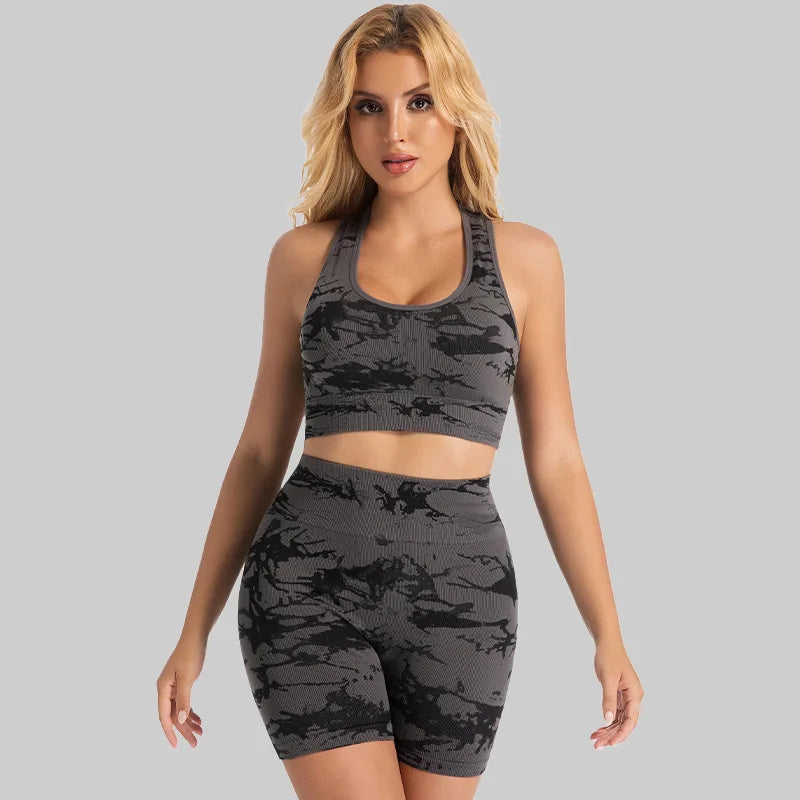 Woman wearing the Mind Body and Soles Power Vibe Energy seamless sports bra and high-waisted shorts set in Grey.