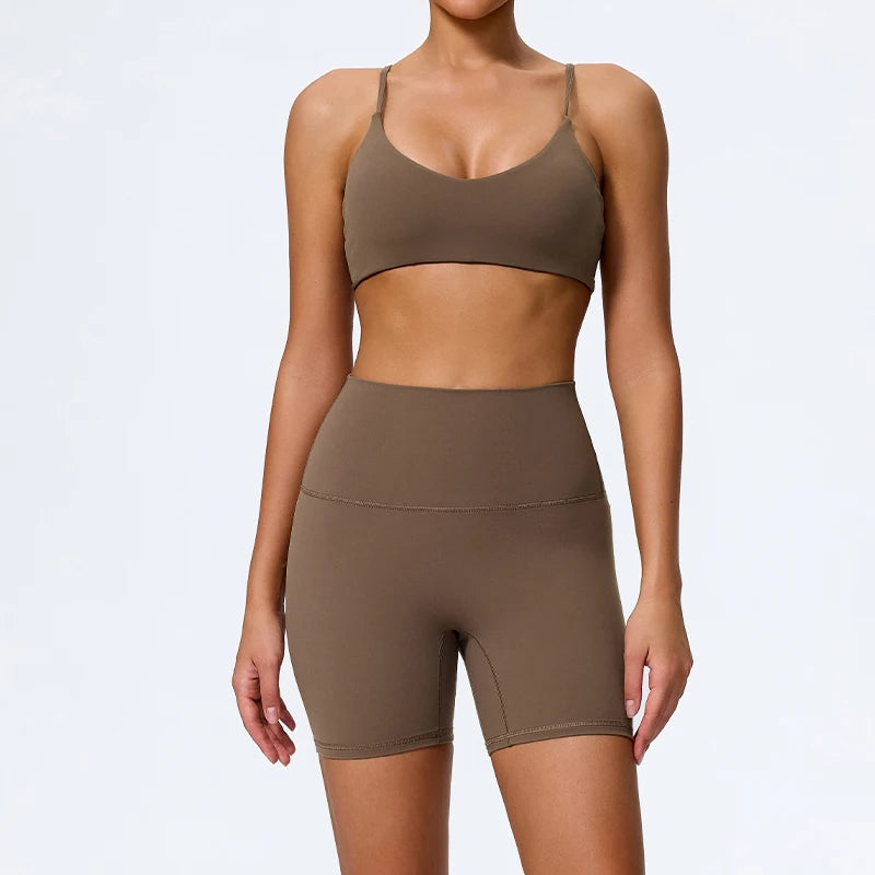 Mind Body and Soles Power Vibe Ignite Set in coffee, premium women's two-piece activewear featuring a supportive sports bra and high-waisted bike shorts. Studio product image showcasing a sculpting fit, buttery-soft performance fabric, high-waisted support, four-way stretch, moisture-wicking comfort and squat-proof confidence for gym workouts, strength training, Pilates, yoga and everyday active living.