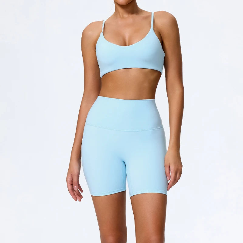 Mind Body and Soles Power Vibe Ignite Set in sky blue, premium women's two-piece activewear featuring a supportive sports bra and high-waisted bike shorts. Studio product image showcasing a sculpting fit, buttery-soft performance fabric, high-waisted support, four-way stretch, moisture-wicking comfort and squat-proof confidence for gym workouts, strength training, Pilates, yoga and everyday active living.