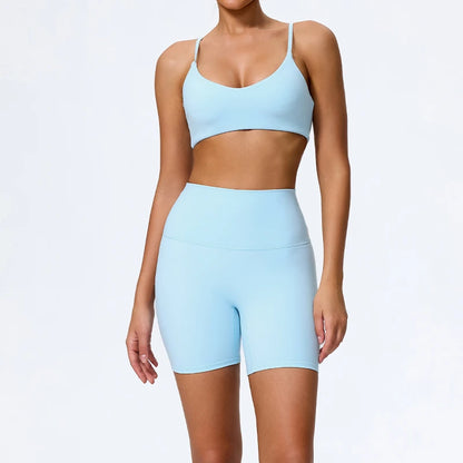 Mind Body and Soles Power Vibe Ignite Set in sky blue, premium women's two-piece activewear featuring a supportive sports bra and high-waisted bike shorts. Studio product image showcasing a sculpting fit, buttery-soft performance fabric, high-waisted support, four-way stretch, moisture-wicking comfort and squat-proof confidence for gym workouts, strength training, Pilates, yoga and everyday active living.