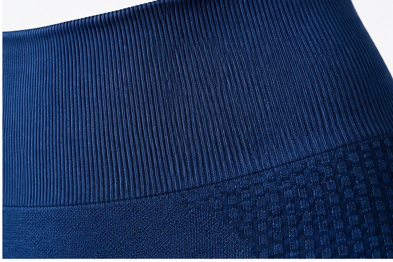 Power Vibe™ Sculpt royal blue women’s seamless leggings close-up showing the wide ribbed high-rise waistband and textured knit construction for a secure, supportive activewear fit.
